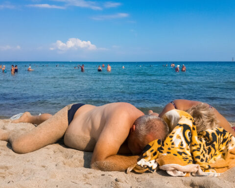 drunk parents asleep at the beach