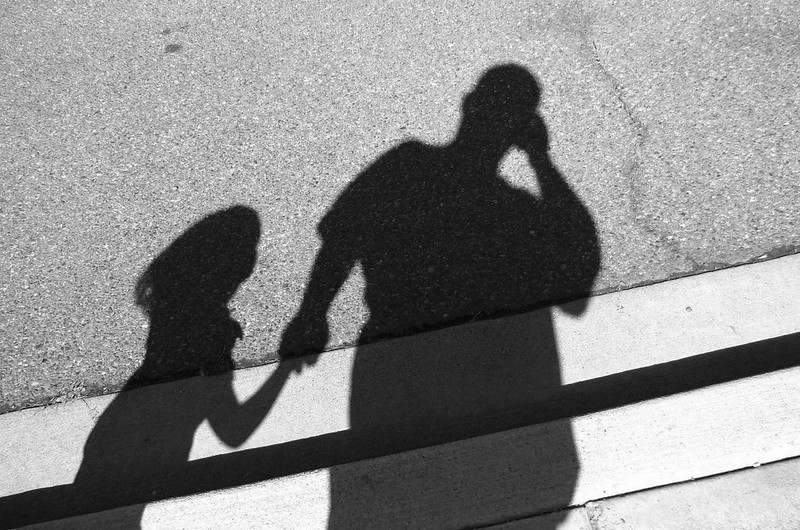 dad and daughter's shadows holding hands - bad dad