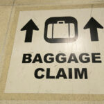baggage claim sign - airport baggage handler