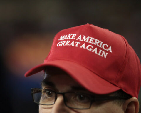 man wearing MAGA hat