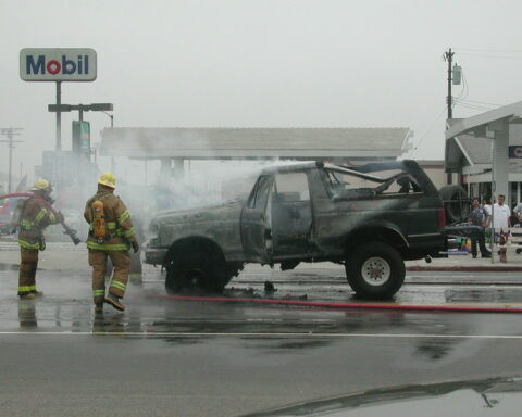 Firefighters extinguish truck - Texas woman lights truck on fire