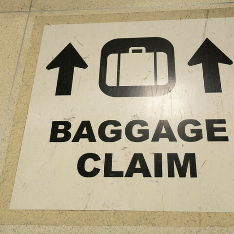 baggage claim sign - airport baggage handler